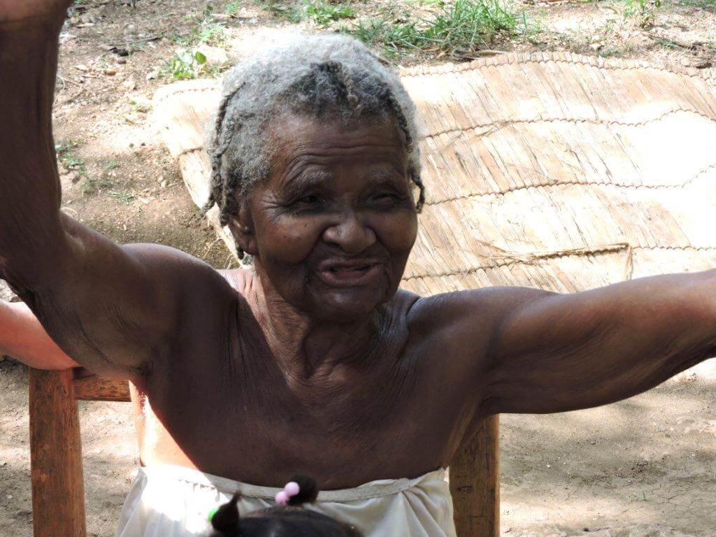 This was a 104 year old lady, who just started singing praises when we gave her food and prayed for her. See video below.