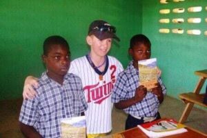Nolan passing out the Book of John Creole Bible. 