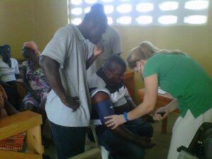 Molly doing check-ups for the staff and their families.