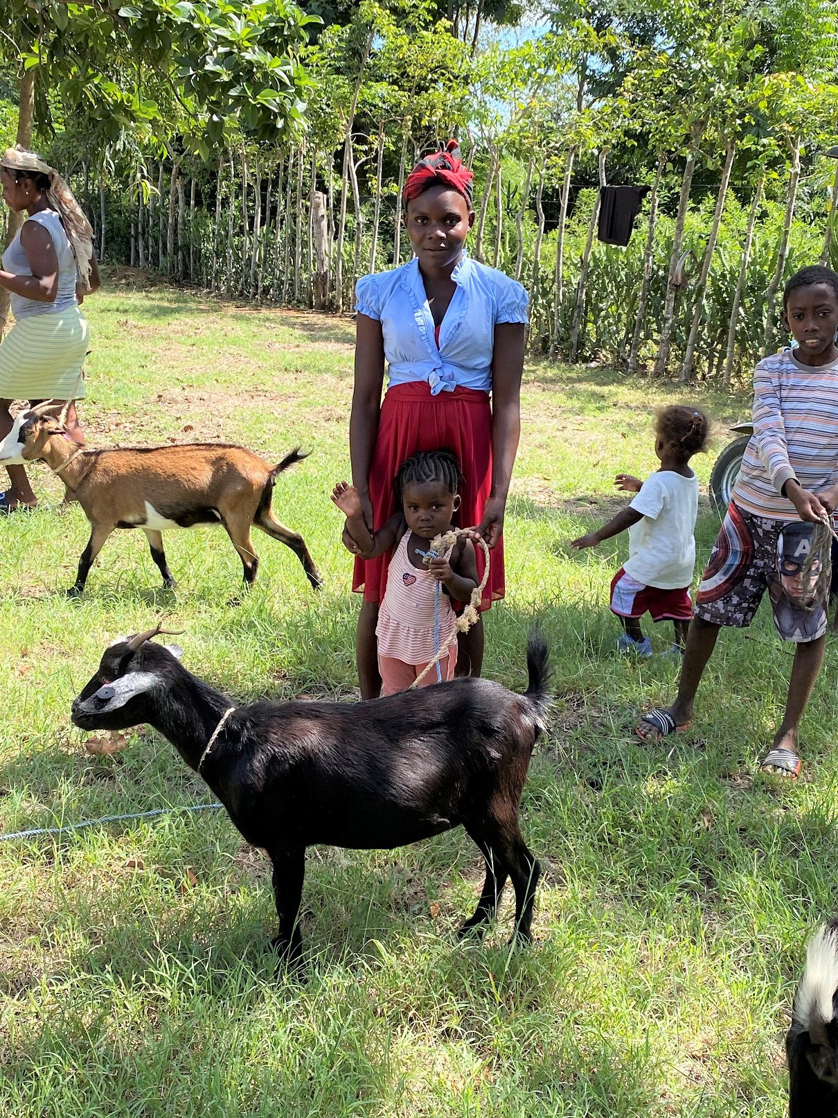 Goat Distribution - Mother and Child hold goat together
