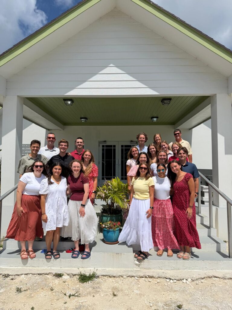 The complete Kairos impact team poses together outside Kirk of the Pines church on Sunday, reflecting on a week of heart transformation and intentional service with Many Hands in Abaco.