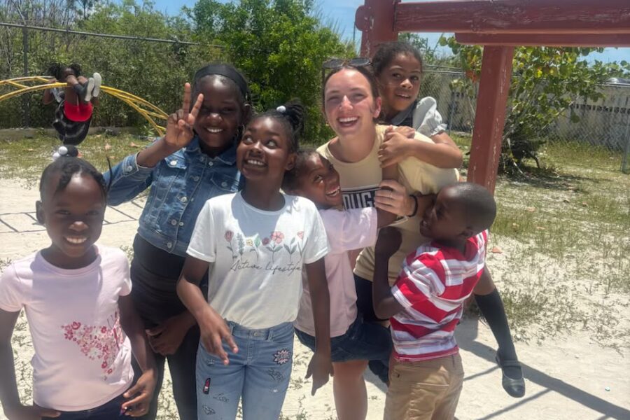 Lutheran Church of Hope Ames volunteers experience mutual joy while interacting and playing with local students during recess at a school in Abaco.
