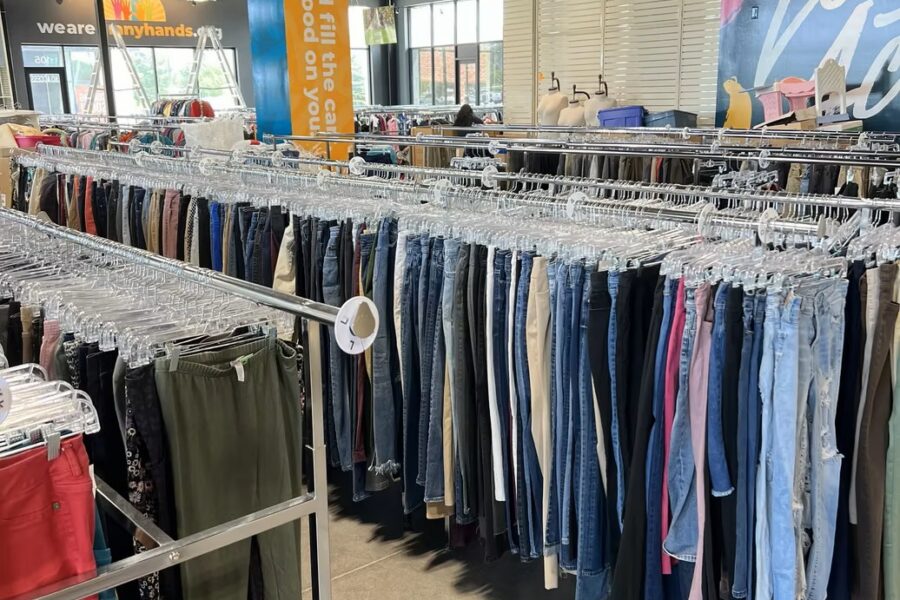 Rows of clothing racks stocked with pants and denim at the new Jordan Creek Thrift Store.
